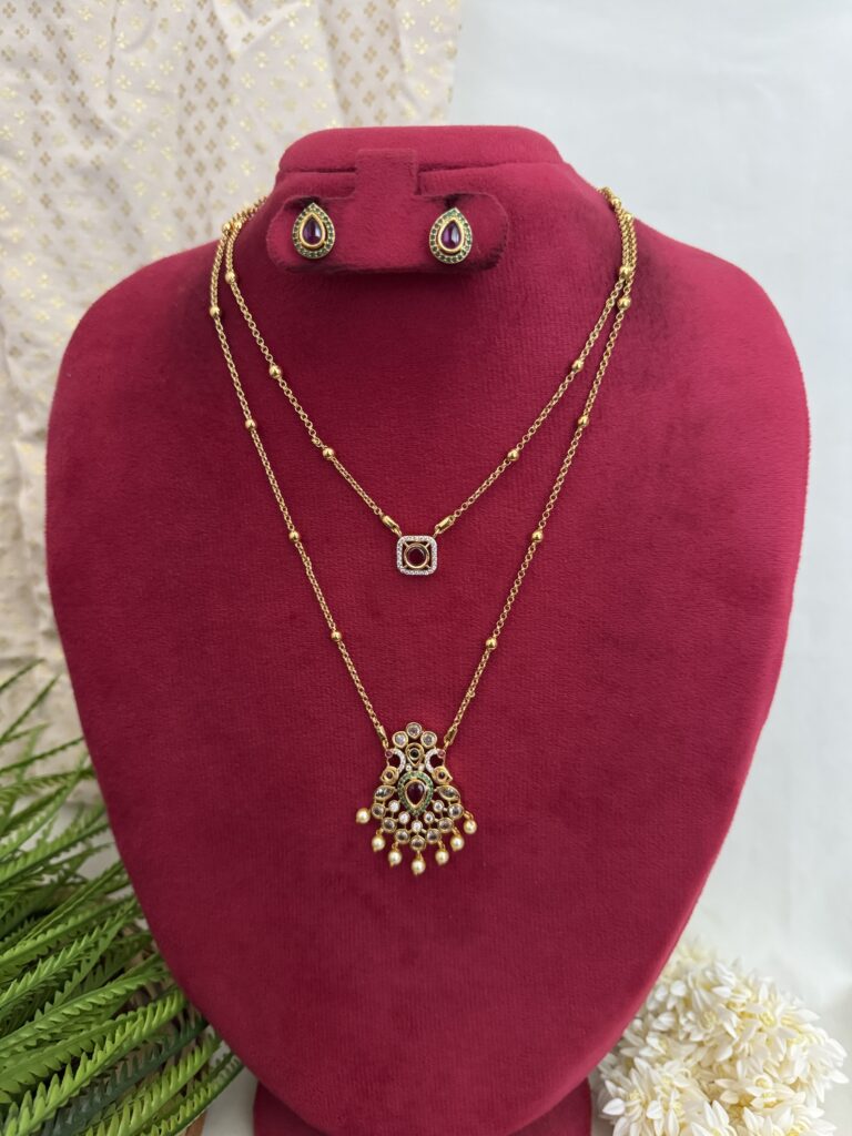 Elegant layered gold pendant jewellery set with matching earrings from Hautecouture Jewellery, designed with fine detailing for a classic and graceful look.