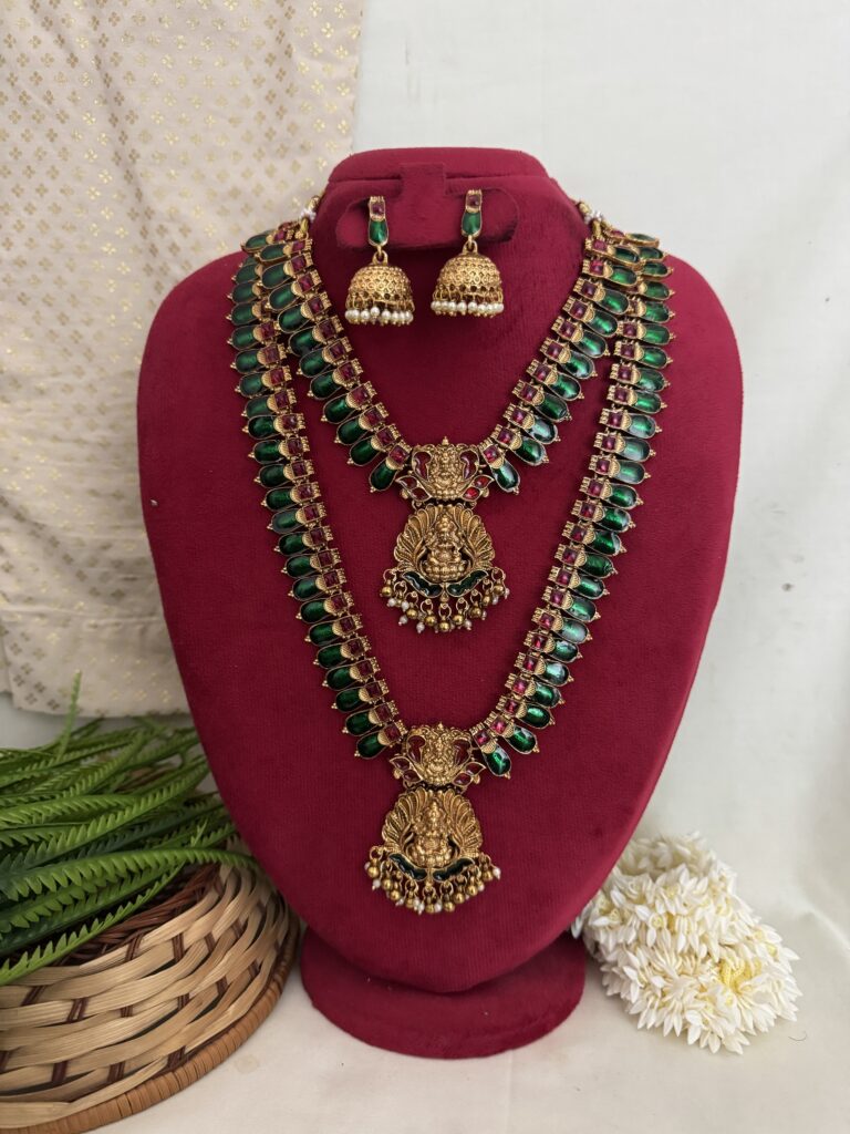 Traditional green and gold haram jewellery set with matching jhumka earrings from Hautecouture Jewellery, showcasing elegant craftsmanship and festive design.