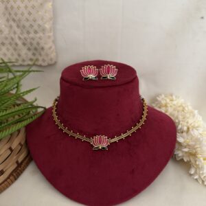 Lotus Glow Choker set displayed on a red velvet bust, showcasing elegant pink lotus motif choker jewelry for special occasions.