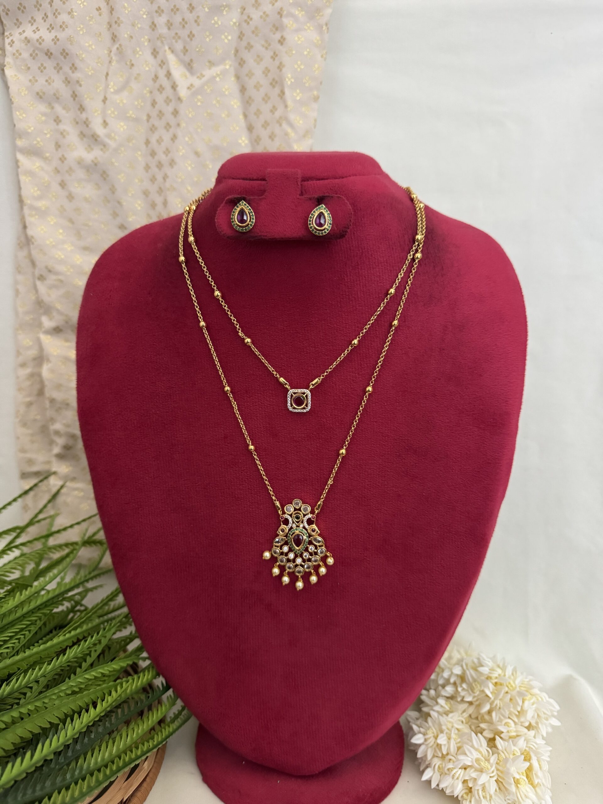 Elegant layered gold pendant jewellery set with matching earrings from Hautecouture Jewellery